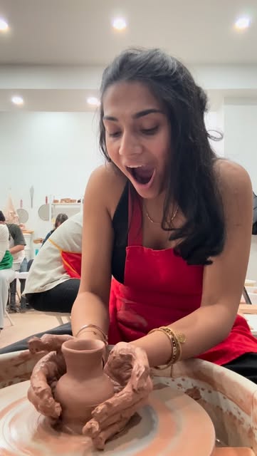 Throwing a small vase on the pottery wheel